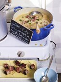 Pea soup with bacon-wrapped plums for a party