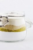 Icing sugar, ground pistachios, ground almonds and flour in a jar