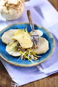 Gratinated sliced celeriac with buckwheat and scamorza