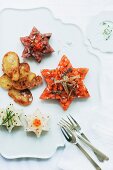 Star shaped fish tartar with salmon, tuna and turbot (Christmas)