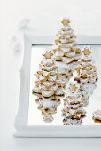Almond Christmas trees with icing and icing sugar