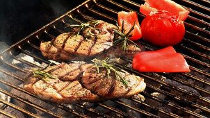 Lamb with red pepper and tomato on a barbecue