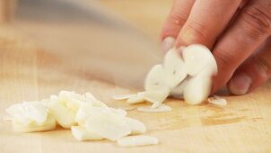 Garlic being sliced