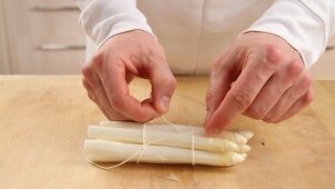White asparagus being tied together