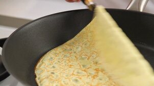 A crepe being turned