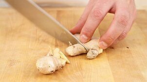 Ginger being peeled