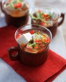 Tofu and tomato soup with spring onions