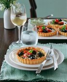 Olive and tomato tartlets with basil