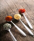 Herbs and spices: oregano, paprika, curry powder and saffron