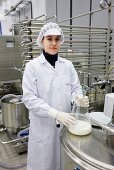Food technician testing milk quality