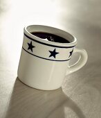 Black Coffee in a Mug with Stars