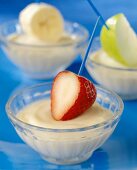 Small Bowls of Vanilla Yogurt with Strawberry, Apple and Banana Slices