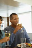 Couple drinking white wine with meal