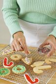 Putting Sprinkles on Holiday Cookies