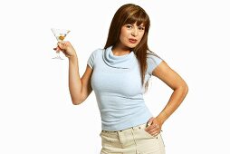 Woman Holding Martini on White with Hand on Hip