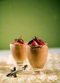 Two Glasses of Chocolate Mousse with Strawberries and Chocolate Shavings