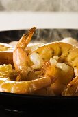 Prawns being fried in a pan