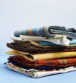 Pile of Various Folded Cloth Napkins