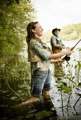 Daughter and Father Fly Fishing in the River