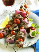Three Grilled Lamb Kabobs on a Plate