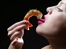 Woman Eating a Shrimp