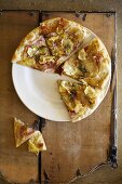 Roasted Fingerling Potato, Parsnip and Prosciutto Pizza; Sliced on Plate; From Above