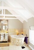 Candles lit in an attic bathroom