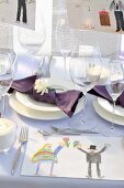 A festively decorated table with children's drawings (cropped)