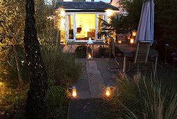 A garden lit with lanterns