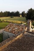 View across the roof of old house onto the Italian countryside