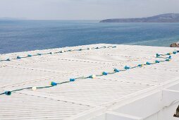 View over the roof of a beach house to the sea