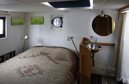 Cabin with a vanity and mirror in a house boat