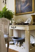 Crockery on a white shelf against a wall