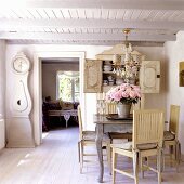 A dining area in a 19th century German thatched-roof house decorated in Scandinavian style