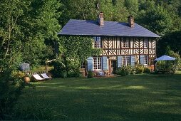 An old half-timbered house with a garden