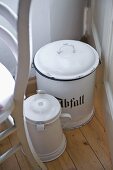 Enamelware pots on floor