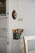 Cutlery in wire tray on cabinet