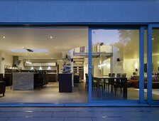 An open sliding terrace door with a view into the living room