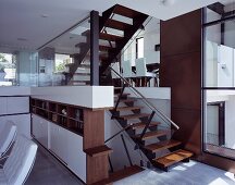 An open stairwell with a view of a dining area in a modern, newly built house