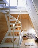A white spiral staircase in an open-plan living room