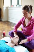A woman having an oil face massage