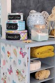 An old magazine rack transformed into a pretty bathroom cabinet.