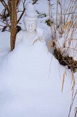 An oriental sculpture in the snow