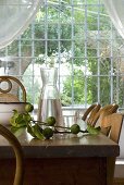 A sprig of limes on a wooden dining table