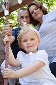 A young family with a little daughter on a day out