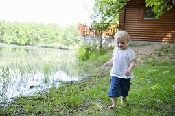 A little girl by a lake