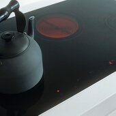 A kettle on a glass hob