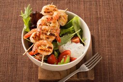 Mixed salad with prawn skewers