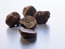 Black truffles, whole and halved