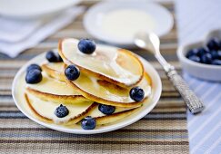 Pancakes with blueberries and yogurt sauce